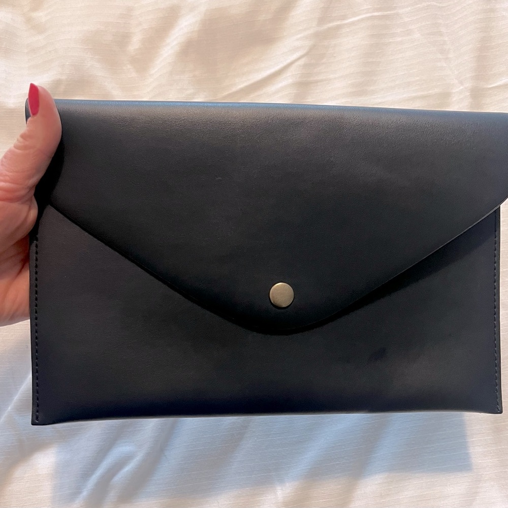 Navy jcrew envelope pouch with gold interior and magnetic snap closure